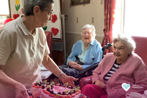 Sr Tomasa celebrating Valentine’s Day with residents at St Augustine’s Addlestone